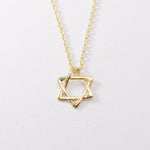 14k Solid Gold Star of David Necklace in a dainty design. Statement necklace ideal for special occasions and gift ideas. Encourages Jewish unity and divine protection.