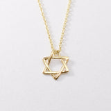 14k Solid Gold Star of David Necklace in a dainty design. Statement necklace ideal for special occasions and gift ideas. Encourages Jewish unity and divine protection.