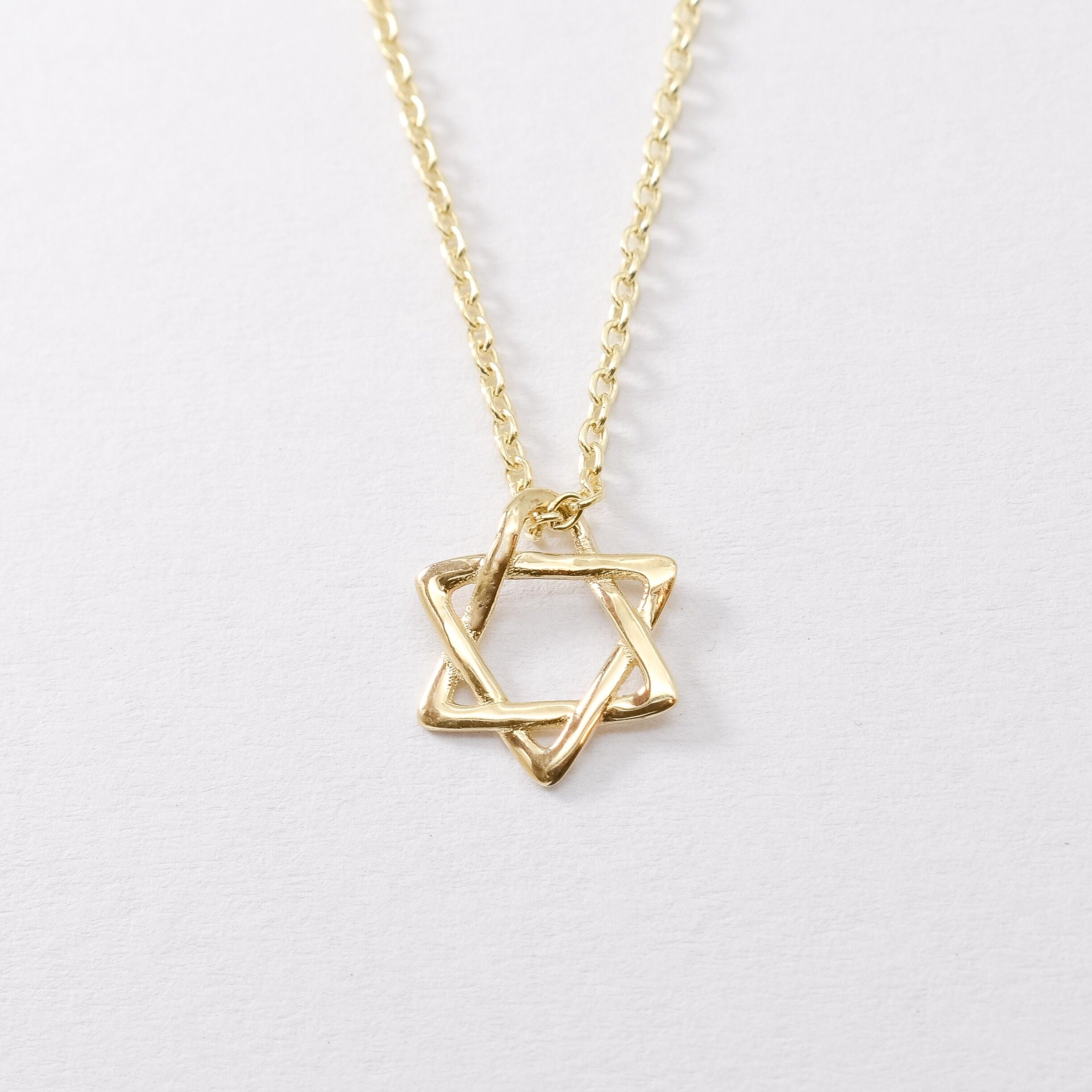 14k Solid Gold Star of David Necklace in a dainty design. Statement necklace ideal for special occasions and gift ideas. Encourages Jewish unity and divine protection.