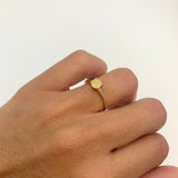 Genuine Fire Opal solitaire ring in 14k solid yellow gold with flashes of fire colors, symbolizing passion and creativity, perfect as an October birthstone engagement, anniversary, or milestone gift.