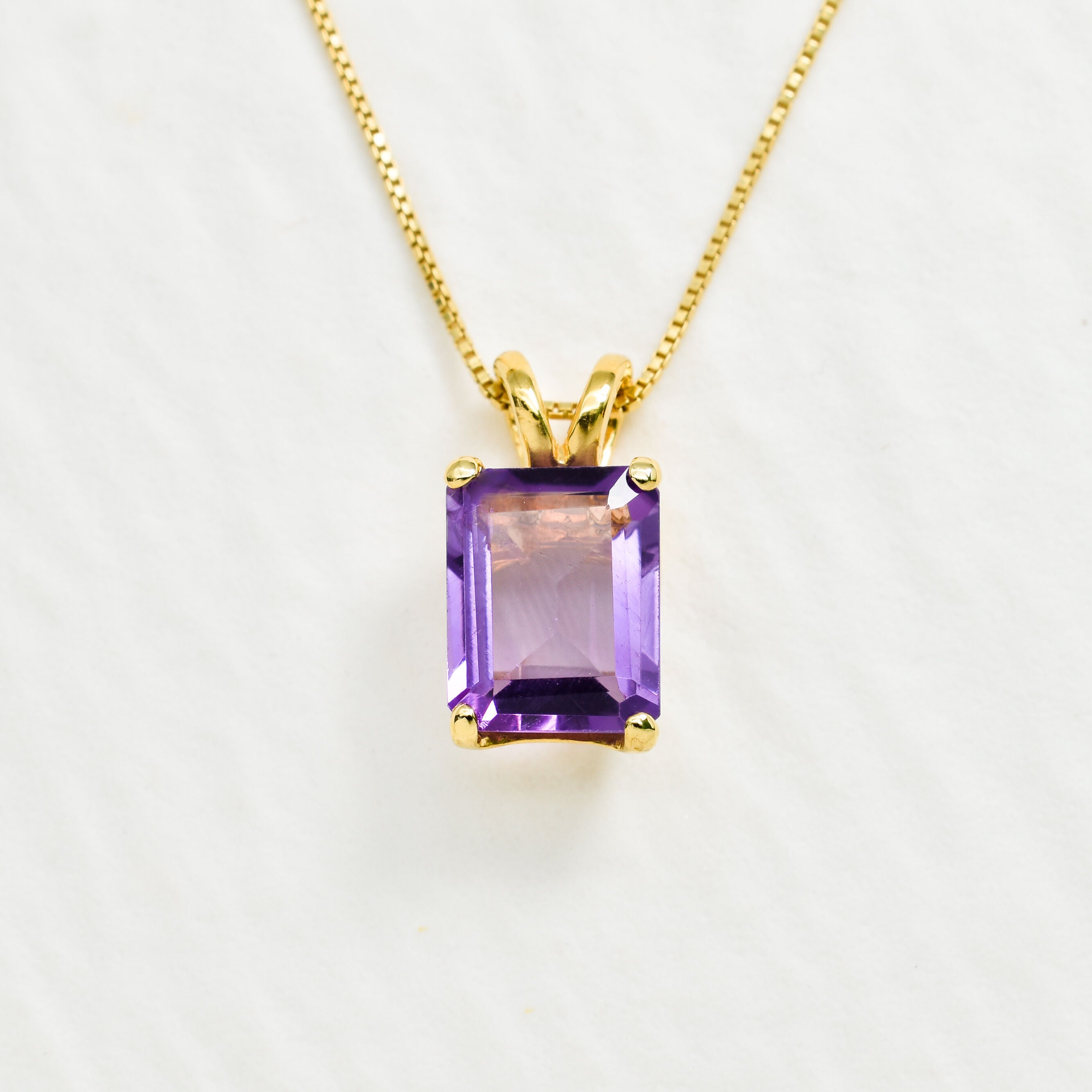 Yellow gold plated necklace with Amethyst February birthstone in radiant cut and prong setting. Purple solitaire necklace ideal for special occasions and birthday gift. Encourages calmness, spiritual growth, and emotional balance.
For peace, clarity, intuition