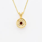 18k yellow gold necklace set with Red Garnet January birthstone, in round cut and prong setting, surrounded with small CZ diamonds. Dainty natural garnet pendant that boosts confidence, enhances courage, and inspires love and success. For passion, protection, & vitality.