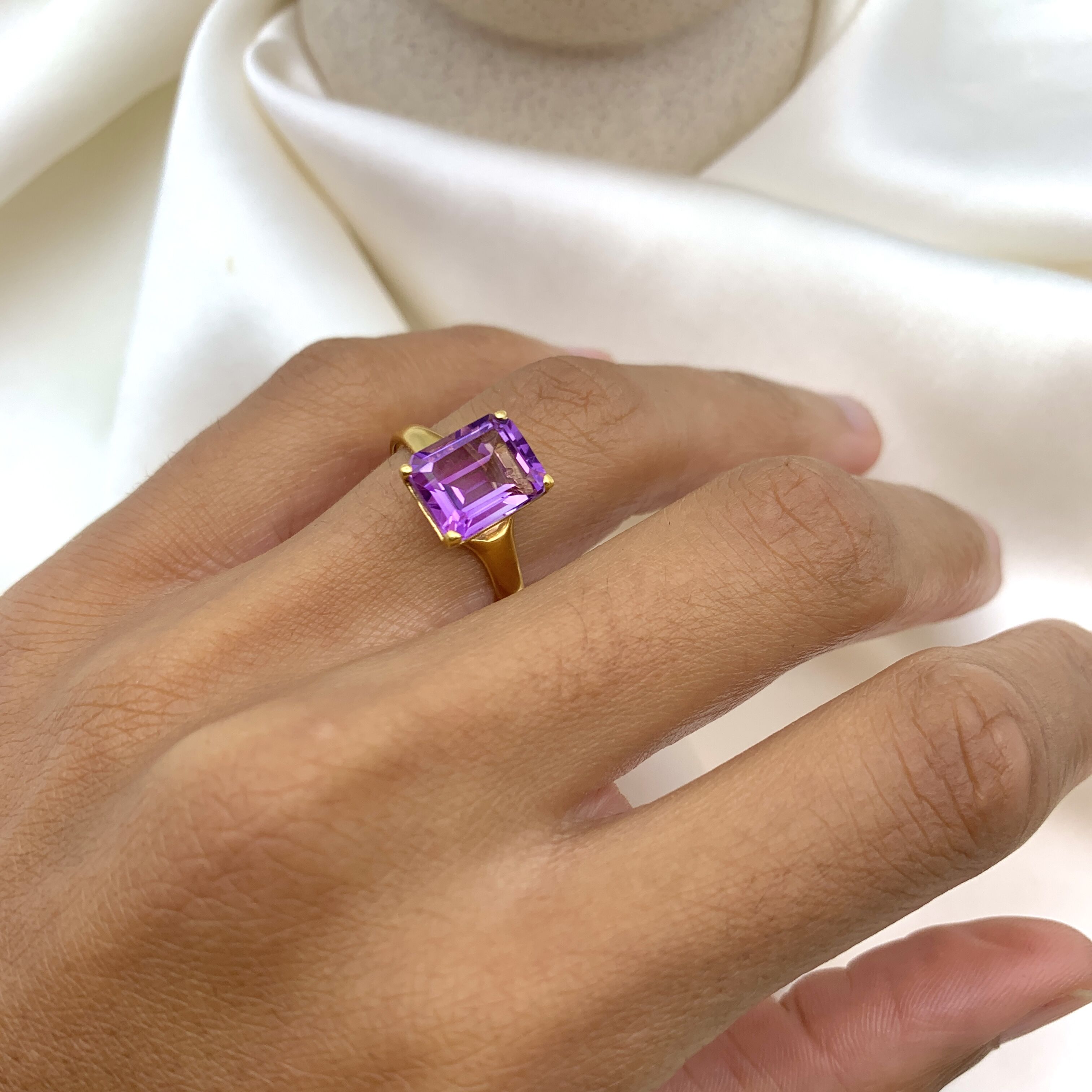 Yellow gold plated ring with natural amethyst February birthstone in emerald cut and prong setting. Bold solitaire ring ideal for anniversary present and birthday gift. For peace, clarity, intuition