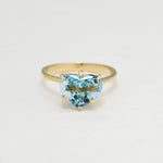 Heart Aquamarine March birthstone ring crafted in 18k Yellow Gold over Solid 925 Sterling Silver. Blue gemstone ring perfect as a valentine's gift idea, can be worn as an everyday ring that brings tranquility, aids in self-expression, and protects travelers. For courage, communication, soothing