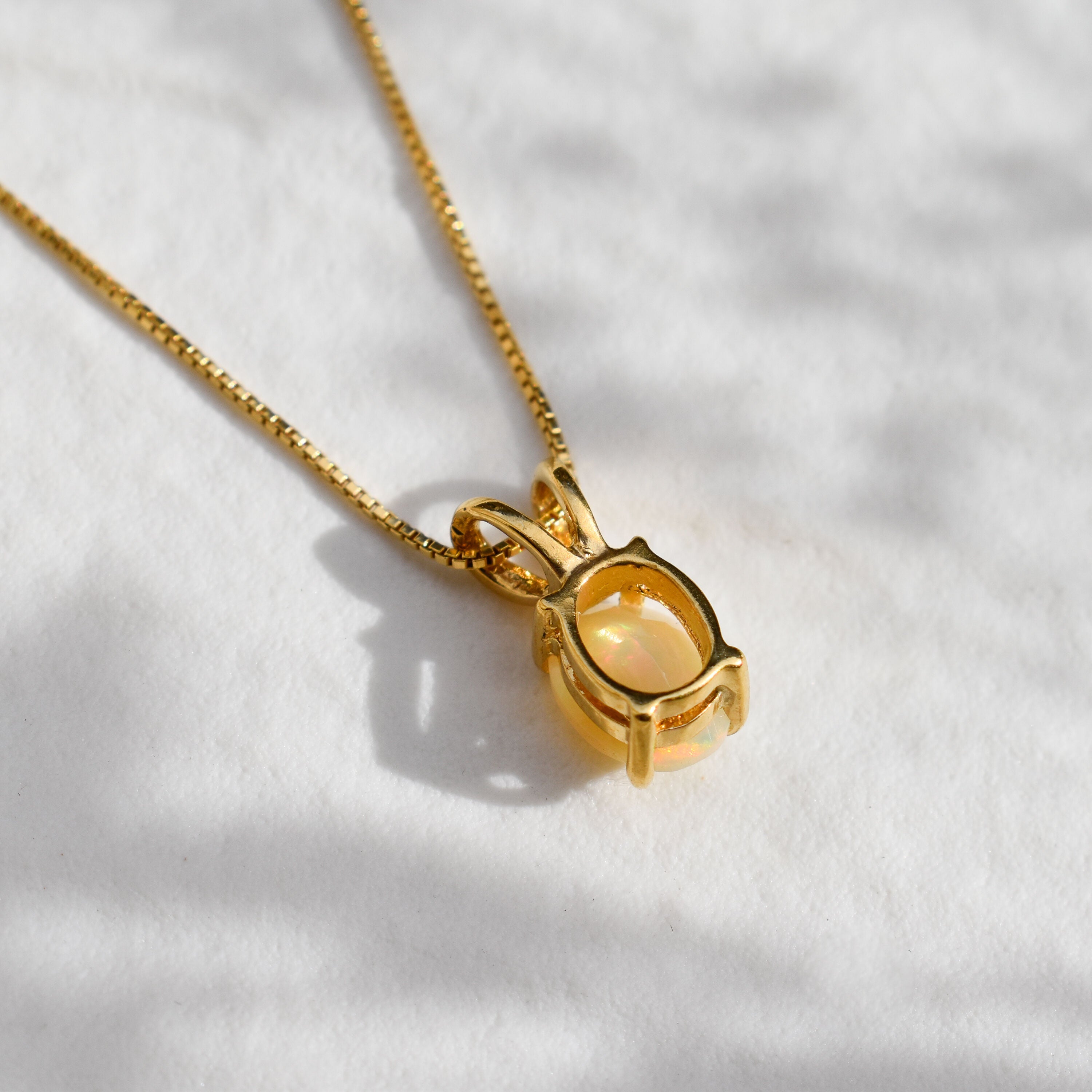 Natural Opal Pendant set in 18k yellow gold over solid 925 sterling silver. October birthstone necklace that is believed to stimulate imagination and love. An oval solitaire necklace gift idea for her, ideal for solo wearing or layering, can be worn on special occasions and casual wears.