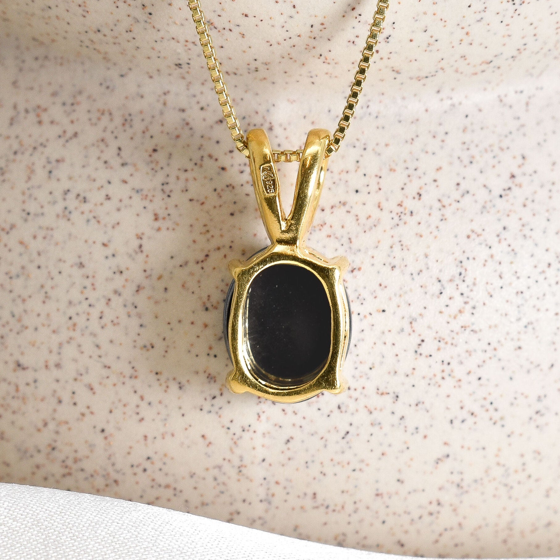 18k yellow gold necklace set with natural black hematite gemstone. Solitaire necklace for enhancing mental clarity and well being.