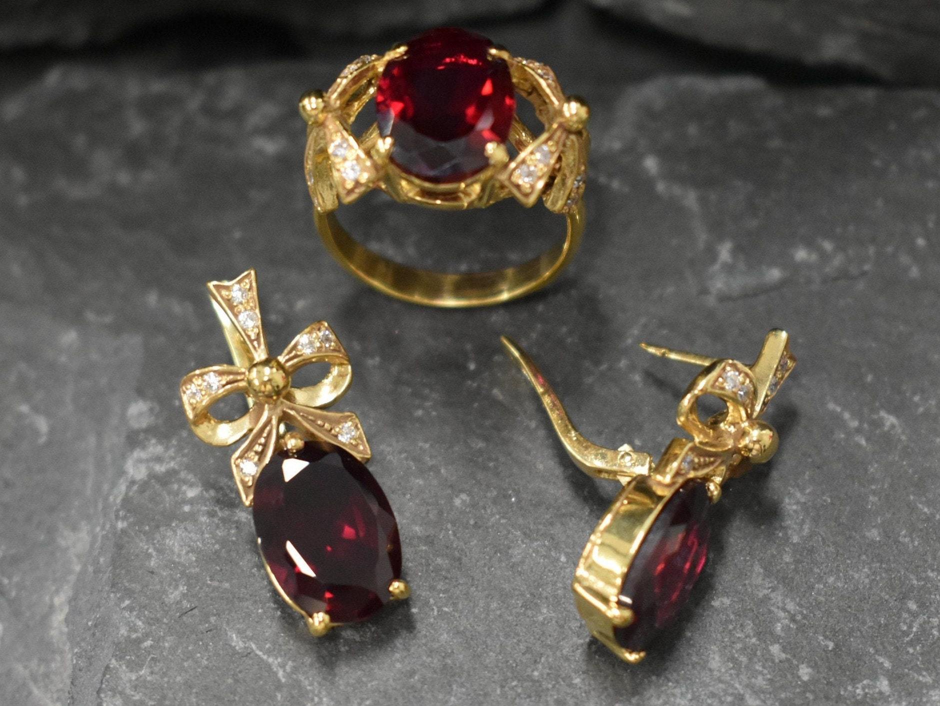 Stunning 18k Gold Vermeil Ring with an Oval Created Red Ruby, symbolizing nobility and perfect for everyday wear.
