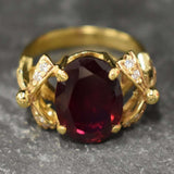 Exquisite 18k Gold Vermeil Ring showcasing an Oval Created Red Ruby, a perfect gift for July birthdays and elegant occasions.