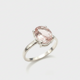 A close-up view of a sparkling gemstone surrounded by delicate gold settings, highlighting its exquisite clarity and brilliance.