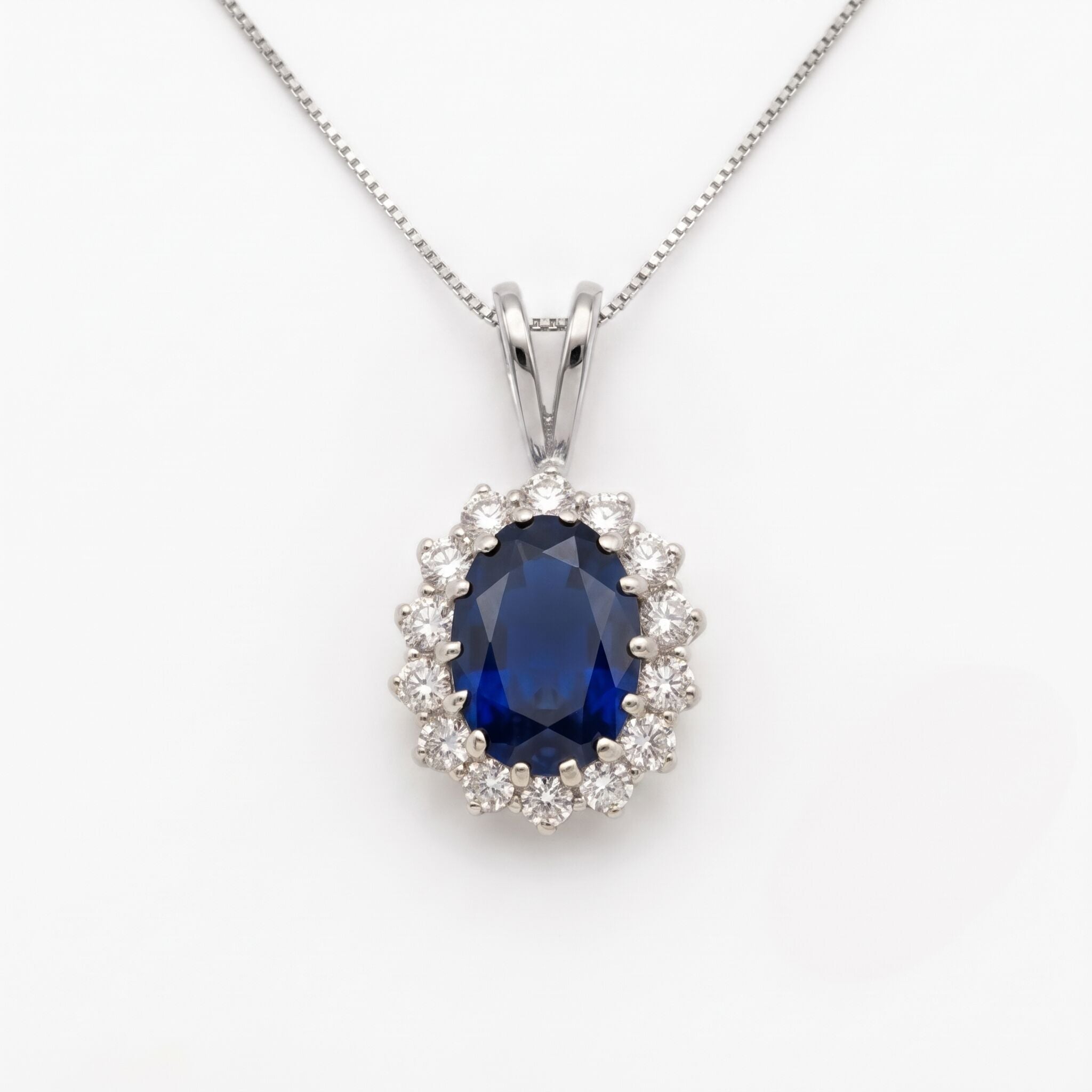 Created Sapphire Pendant made in 925 Sterling Silver with Oval Created Blue Sapphire in Halo setting, September Birthstone gift idea, symbolizes sincerity, truth, and faithfulness, ideal for everyday wear and perfect for birthday gifting and special occasions.