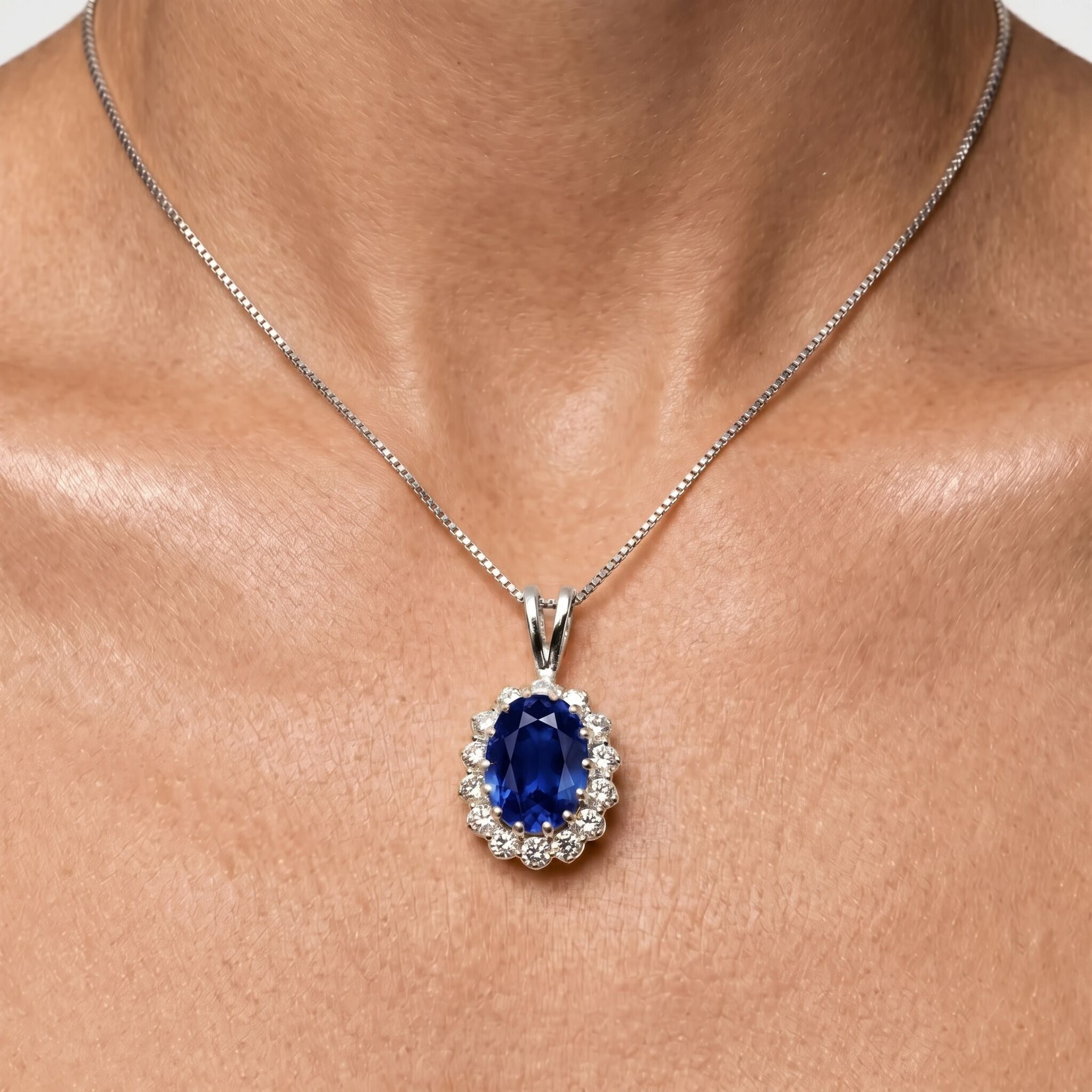 925 Sterling Silver Sapphire Pendant featuring a stunning oval blue sapphire in a halo setting, perfect for special occasions.