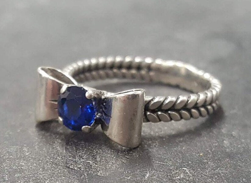Stunning 925 Sterling Silver ring featuring a vibrant round created blue sapphire, perfect for celebrating September birthdays.