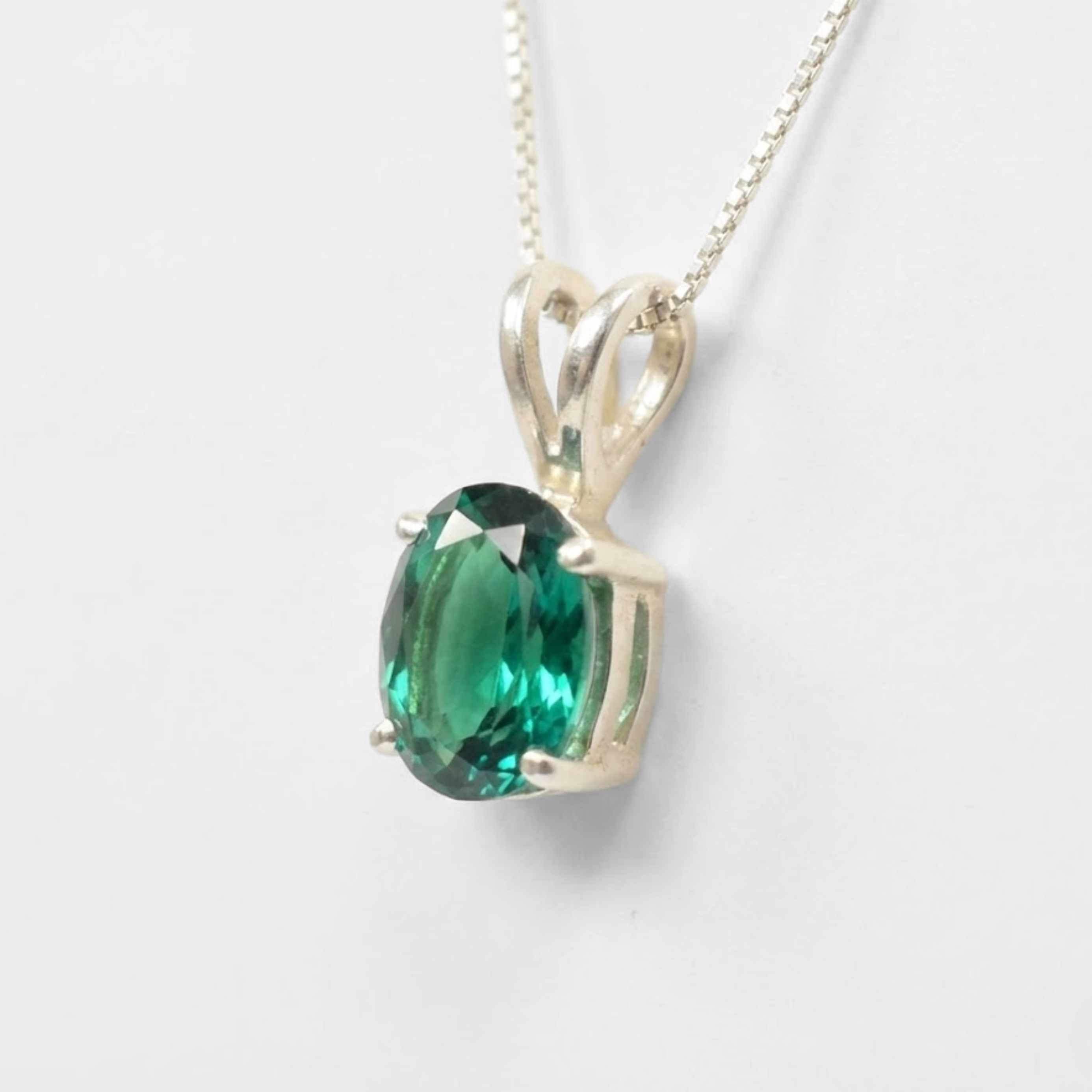 Beautiful 925 Sterling Silver Pendant set with an Oval Created Green Emerald, a timeless May birthstone jewelry piece.