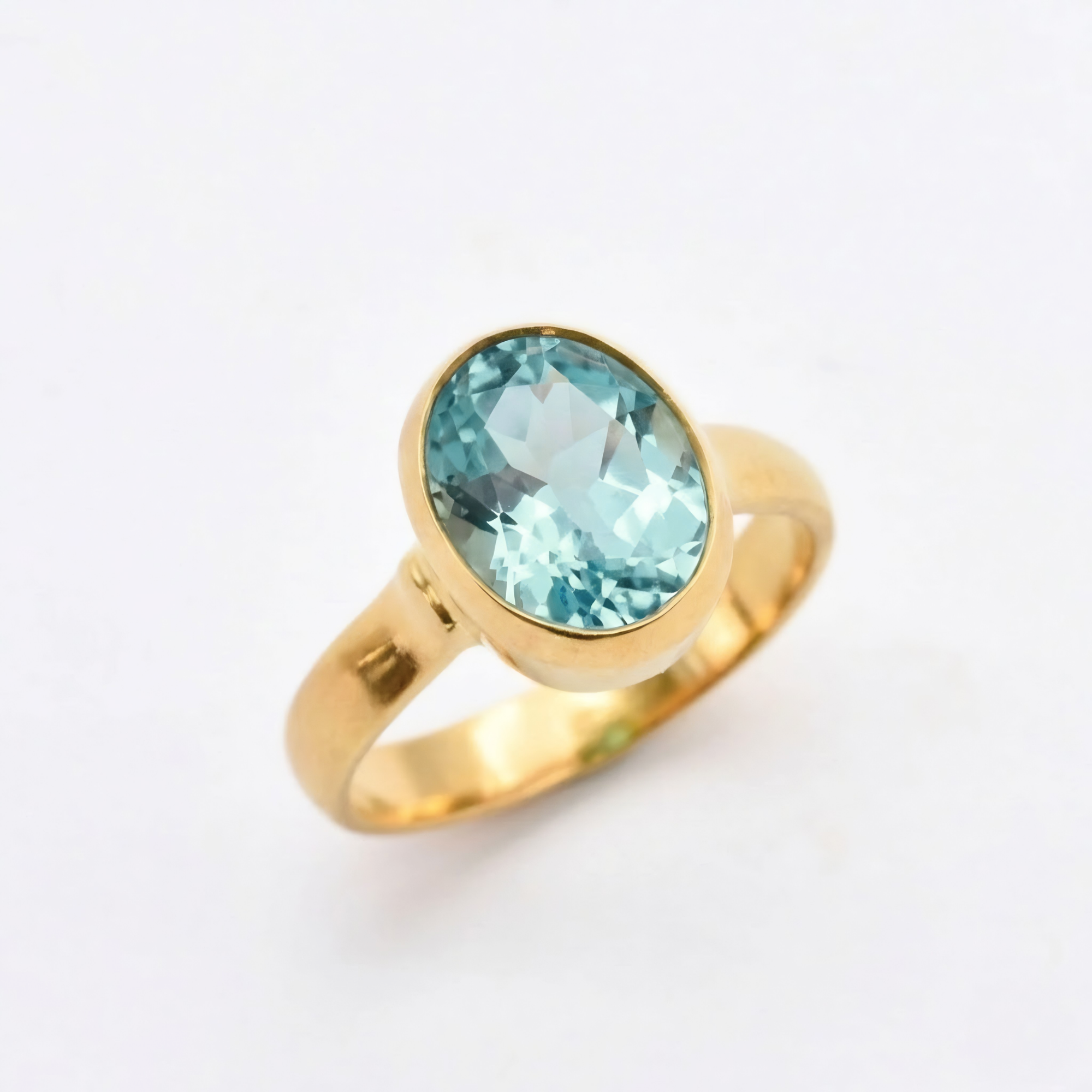 Created Aquamarine Ring made in 18k Gold Vermeil with Oval Created Blue Aquamarine in Bezel setting, March Birthstone gift idea, symbolizes courage & good luck, ideal for everyday wear and perfect for birthday gifting and special occasions.