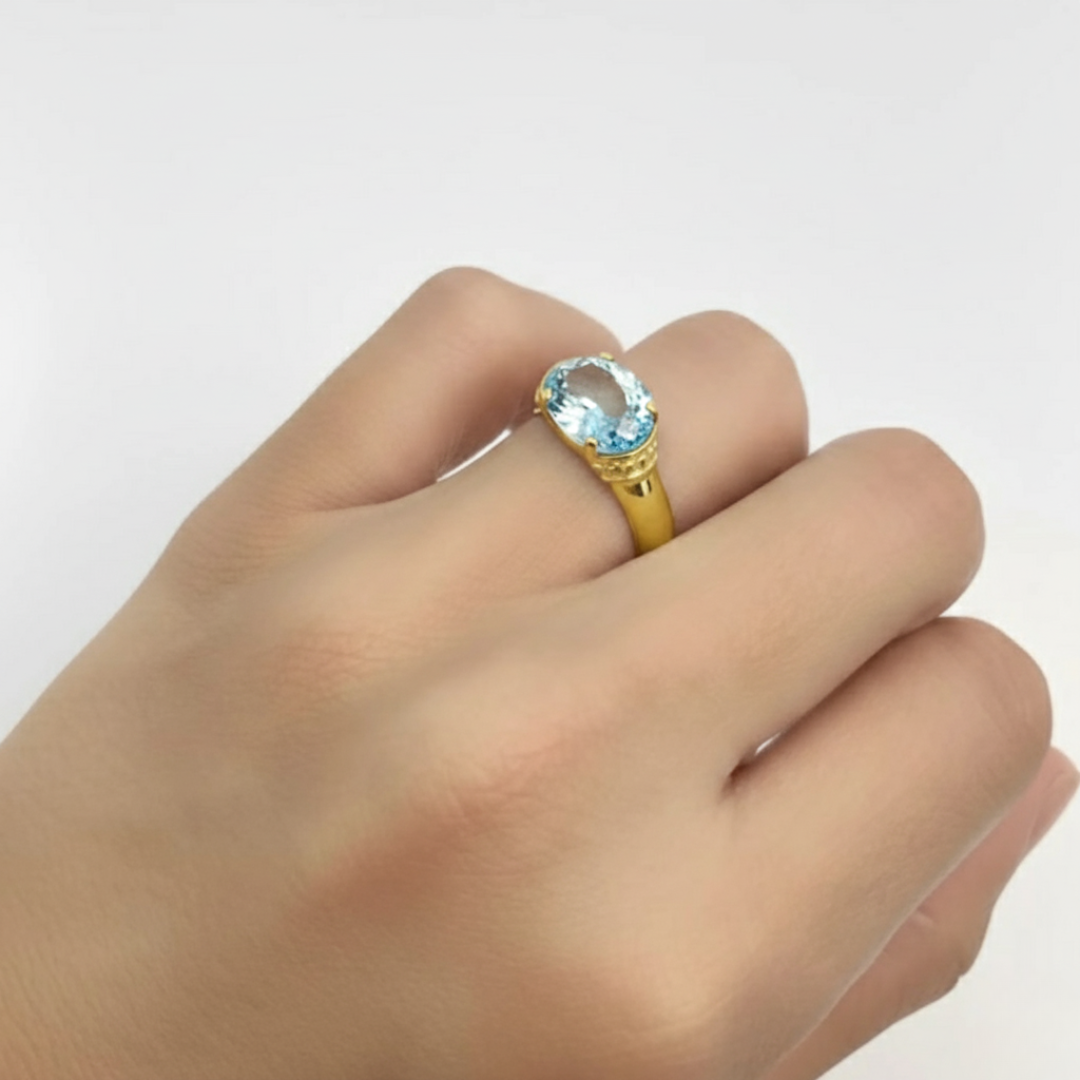Elegant 18k Gold Vermeil Aquamarine Ring with Oval Center Stone, perfect for March birthdays and showcasing courage and luck.