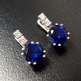 Exquisite Created Sapphire Earrings in 925 Sterling Silver with enchanting blue sapphires, perfect for expressing love and loyalty.