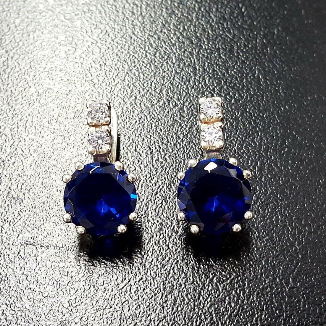 Stylish Created Sapphire Earrings in 925 Sterling Silver with round blue sapphires—great for expressing sincerity and love.