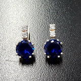 Stylish Created Sapphire Earrings in 925 Sterling Silver with round blue sapphires—great for expressing sincerity and love.