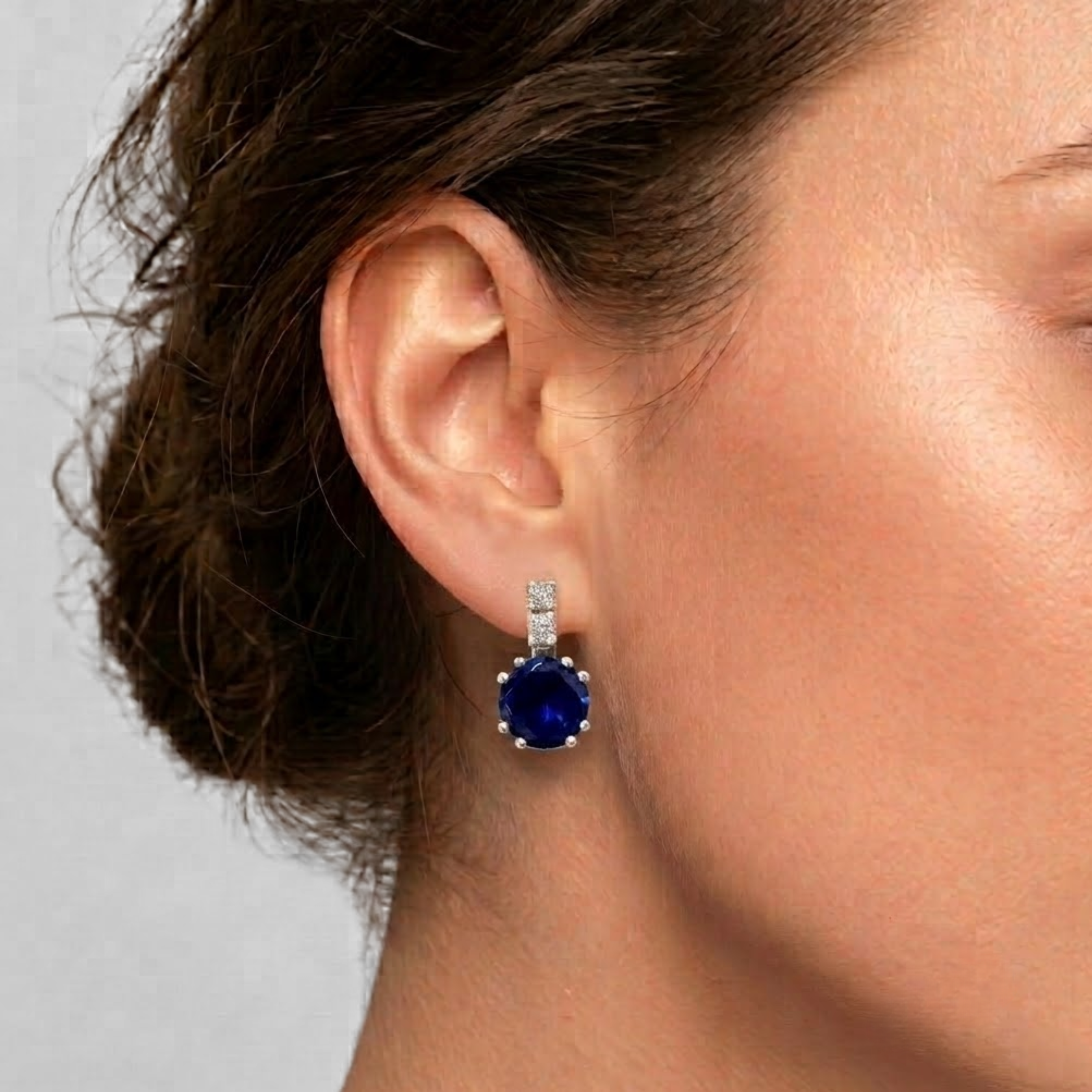 Created Sapphire Earrings in 925 Sterling Silver, showcasing round blue sapphires—perfect for birthdays and special occasions.