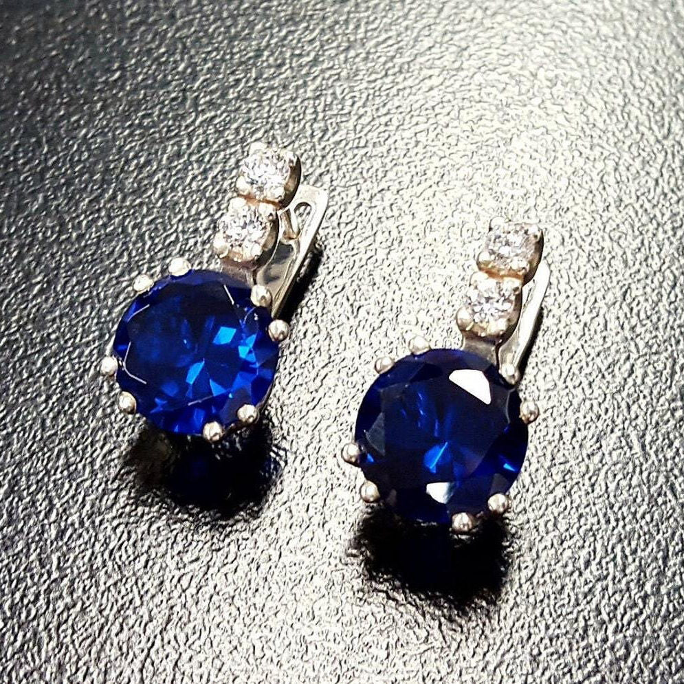 Elegantly designed Created Sapphire Earrings in 925 Sterling Silver, featuring brilliant round sapphires—ideal for daily wear.