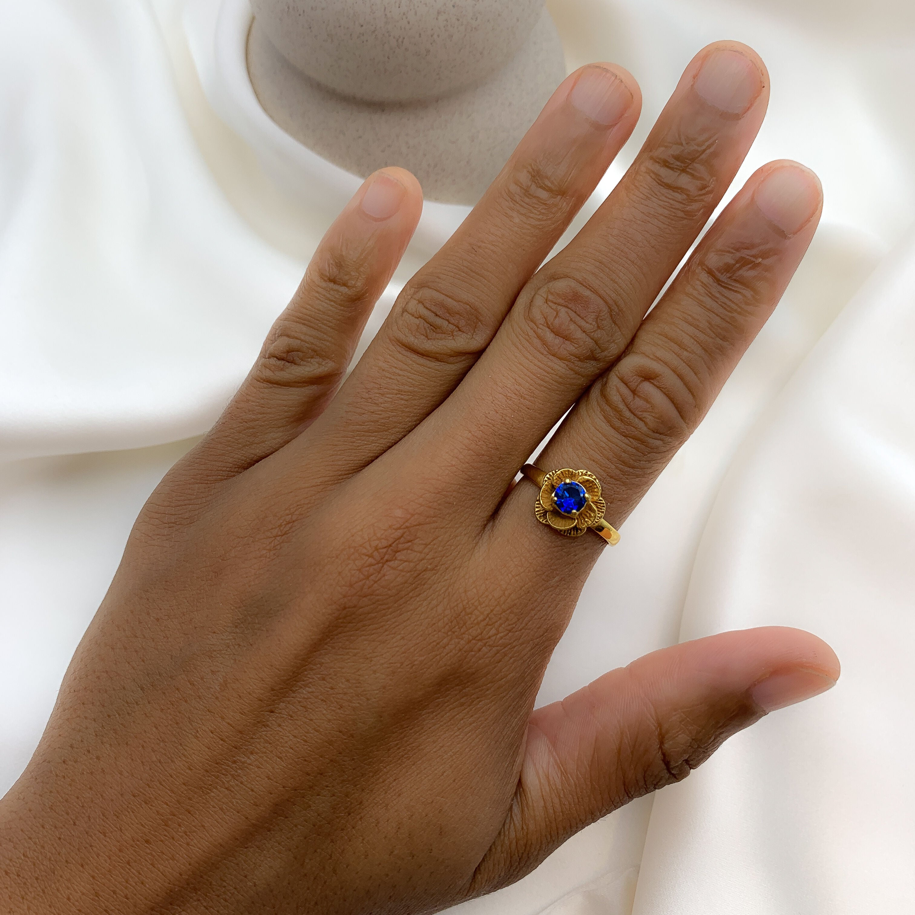 Elegant Created Sapphire Ring in 18k Gold Vermeil, featuring a round sapphire, symbolizes truth and perfect for special occasions.