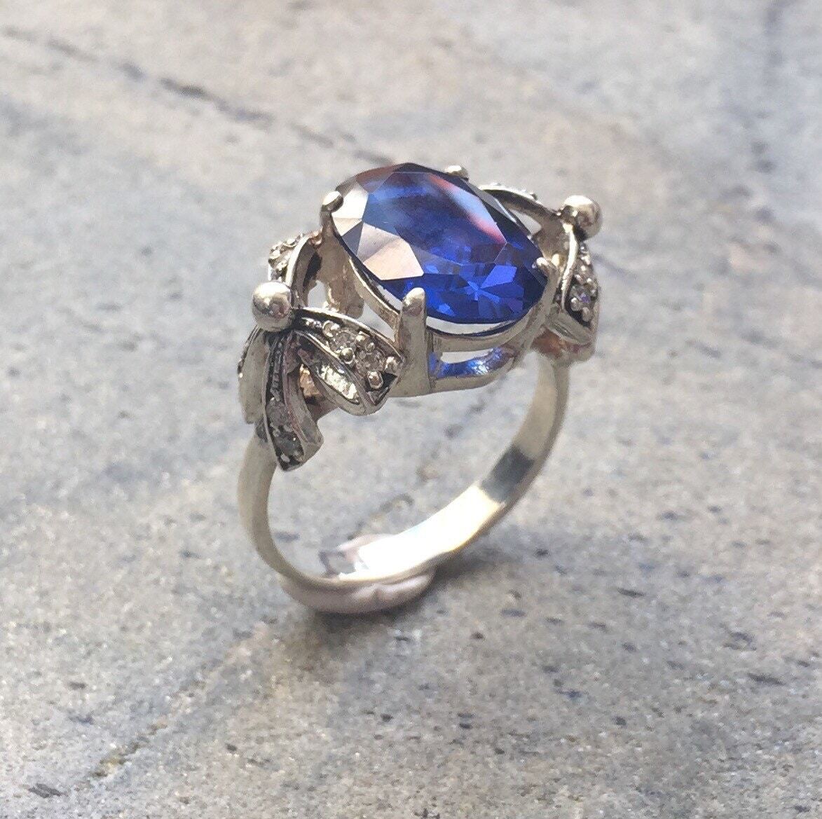 Created Sapphire Ring made in 925 Sterling Silver with Oval Created Blue Sapphire in Solitaire with Accents setting, September Birthstone gift idea, symbolizes sincerity, truth, and faithfulness, ideal for everyday wear and perfect for birthday gifting and special occasions.