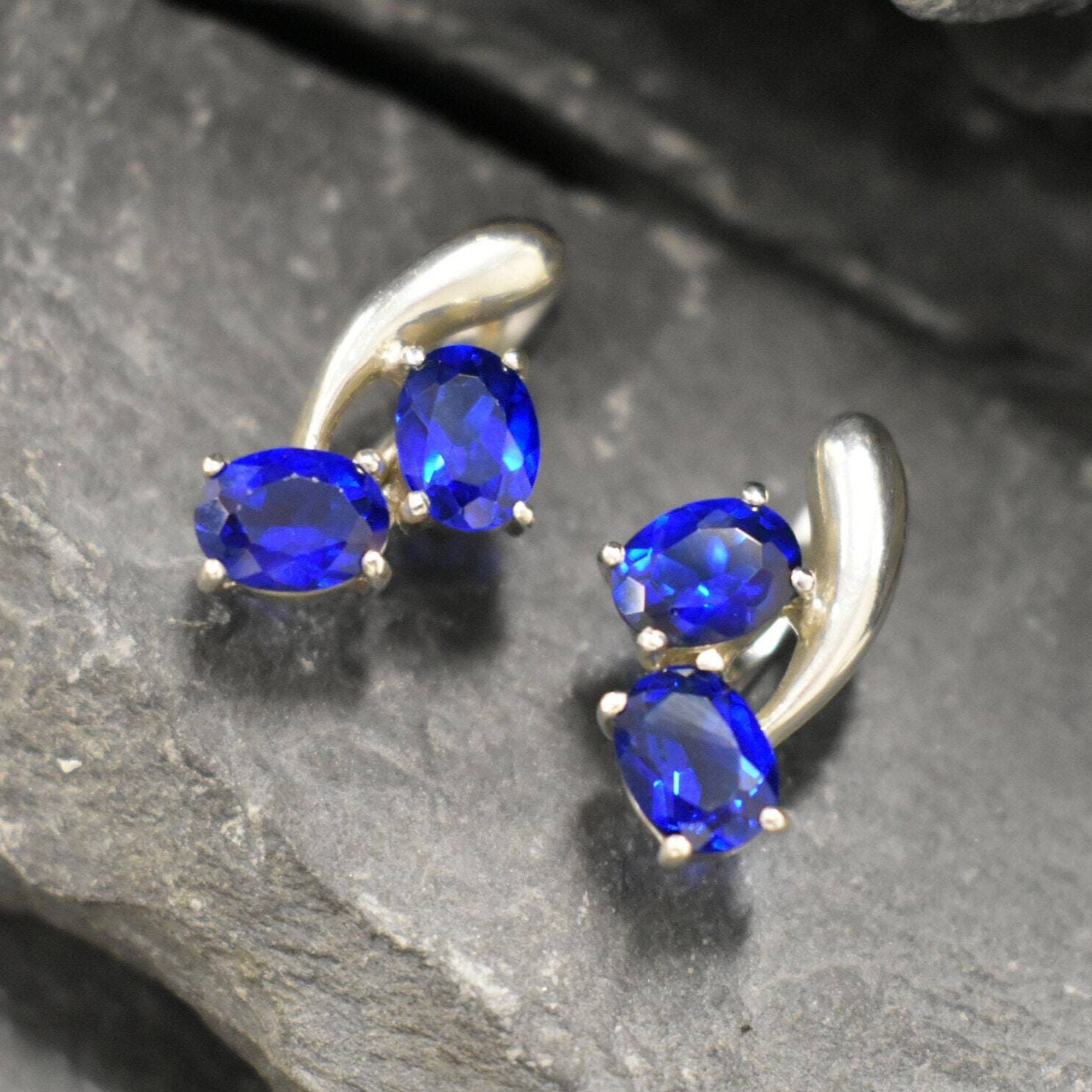 Created Sapphire Earrings made in 925 Sterling Silver with Oval Created Blue Sapphire in Two-Stone setting, September Birthstone gift idea, symbolizes sincerity, truth, and faithfulness, ideal for everyday wear and perfect for birthday gifting and special occasions.