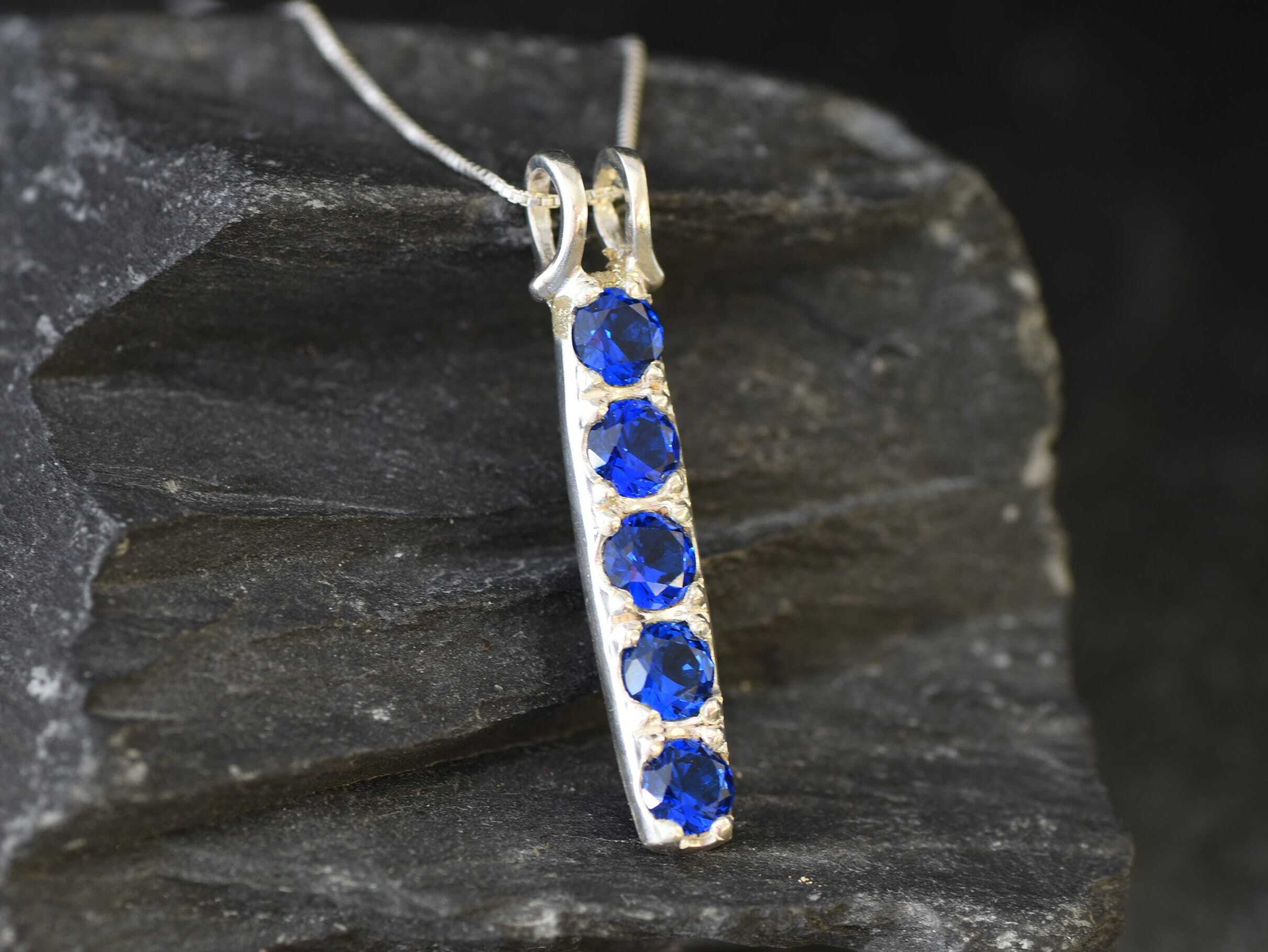 Elegant Created Sapphire Pendant in 925 Sterling Silver, perfect for birthdays and special occasions, symbolizes sincerity and faithfulness.