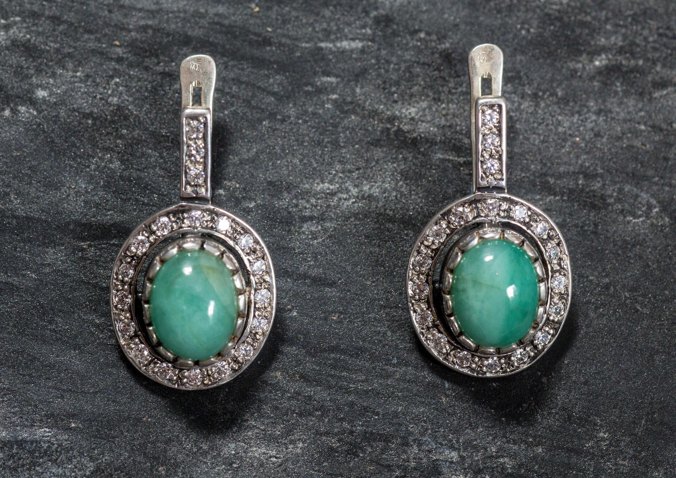 Natural Emerald Earrings made in 925 Sterling Silver with Oval Natural Green Emerald in Halo setting, May Birthstone gift idea, symbolizes growth, harmony, and deep emotional healing, ideal for everyday wear and perfect for birthday gifting and special occasions.