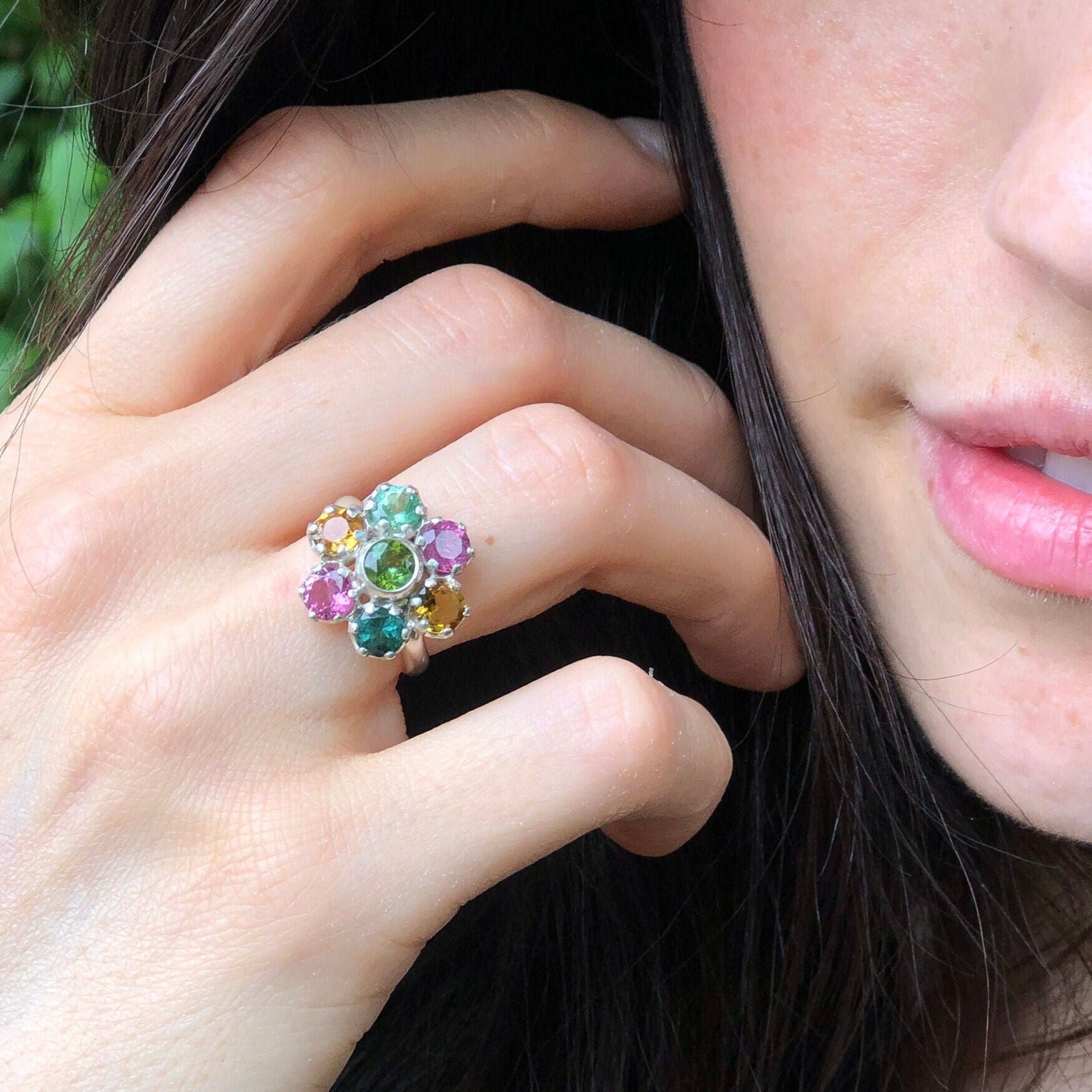 A stunning view of a mountain landscape, with lush greenery and a clear blue sky enhancing the natural beauty.