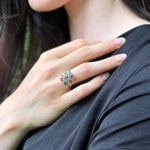 A stylish jewelry box elegantly arranged with sparkling rings, showcasing a variety of unique and colorful designs.