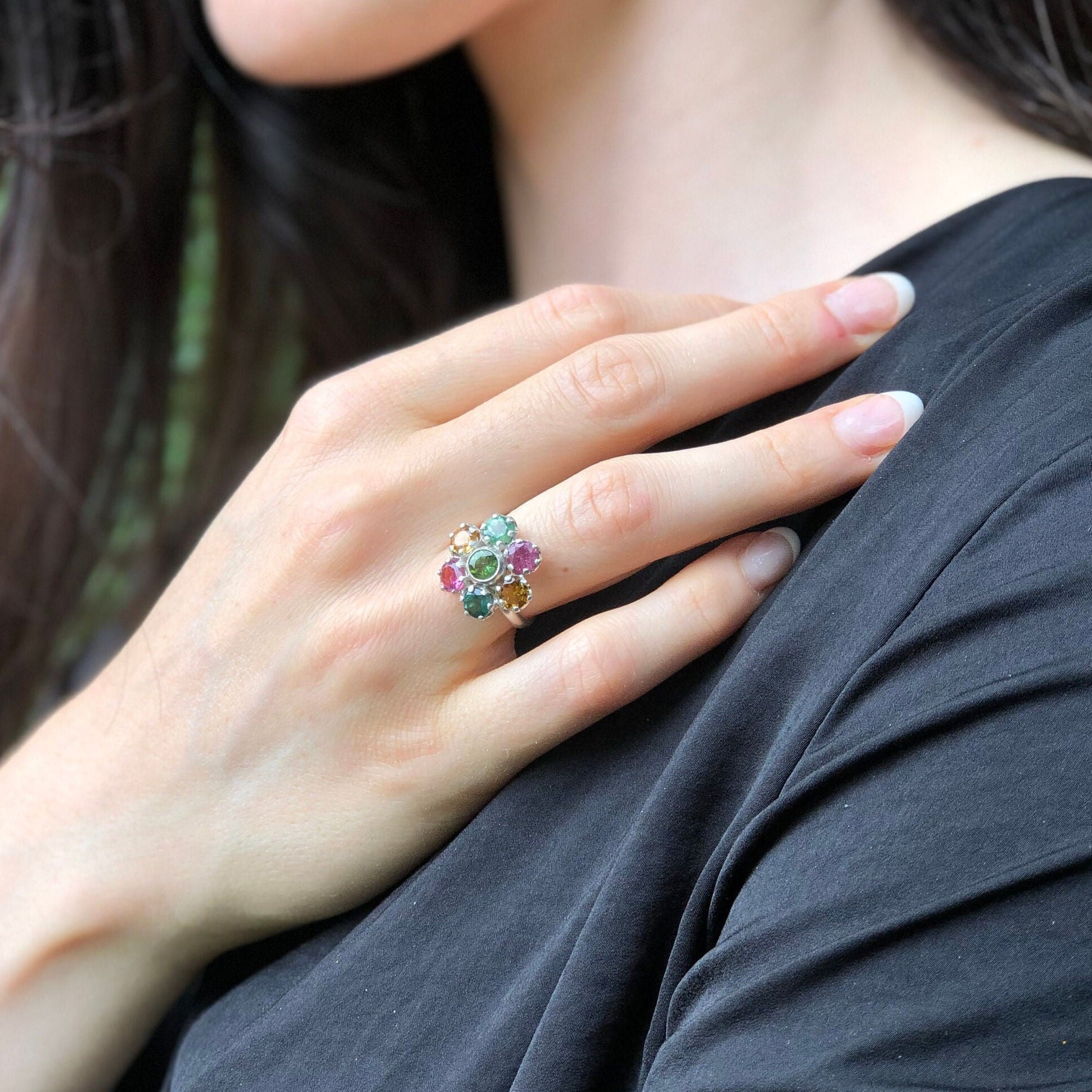 A stylish jewelry box elegantly arranged with sparkling rings, showcasing a variety of unique and colorful designs.