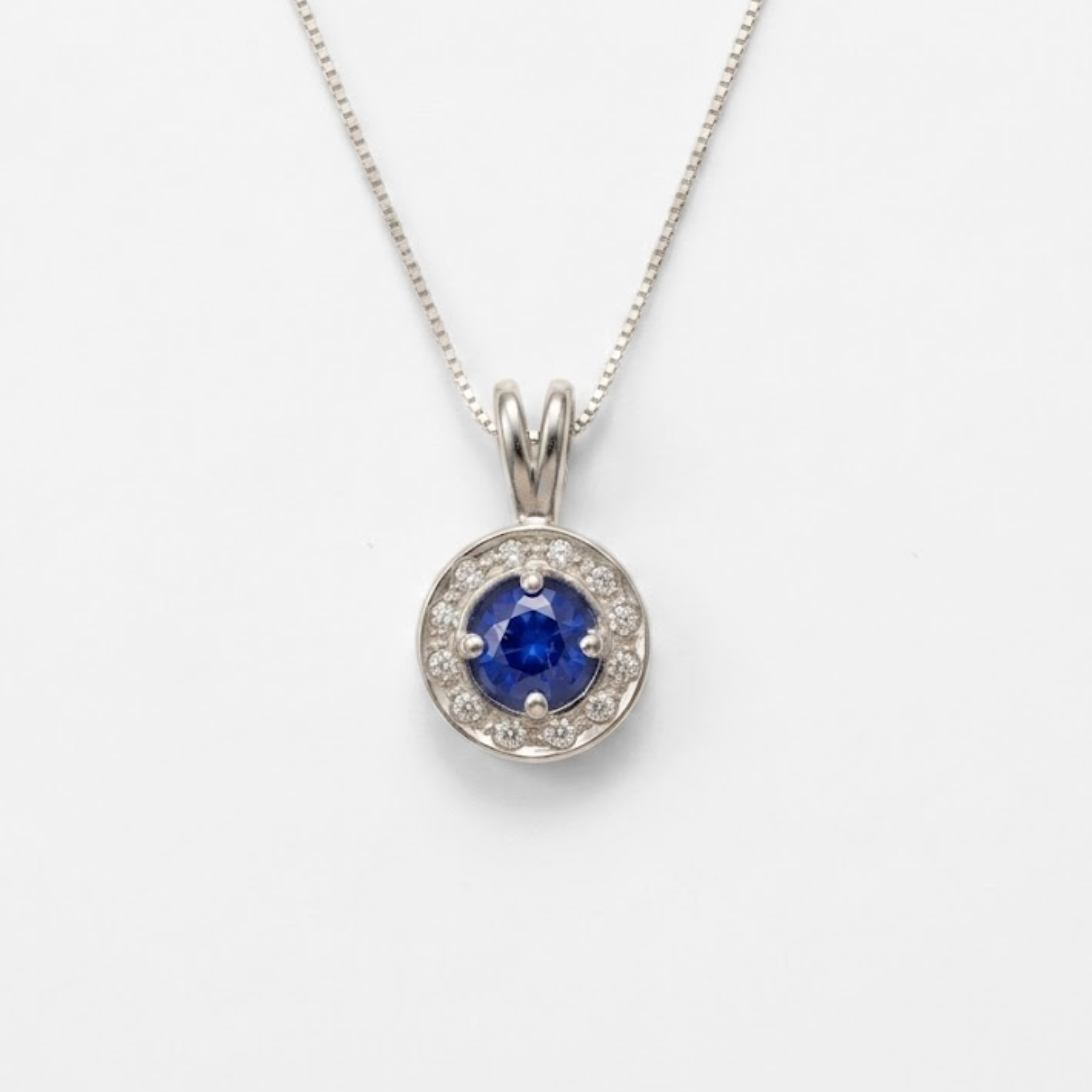 Created Sapphire Pendant made in 925 Sterling Silver with Round Created Blue Sapphire in Halo setting, September Birthstone gift idea, symbolizes sincerity, truth, and faithfulness, ideal for everyday wear and perfect for birthday gifting and special occasions.