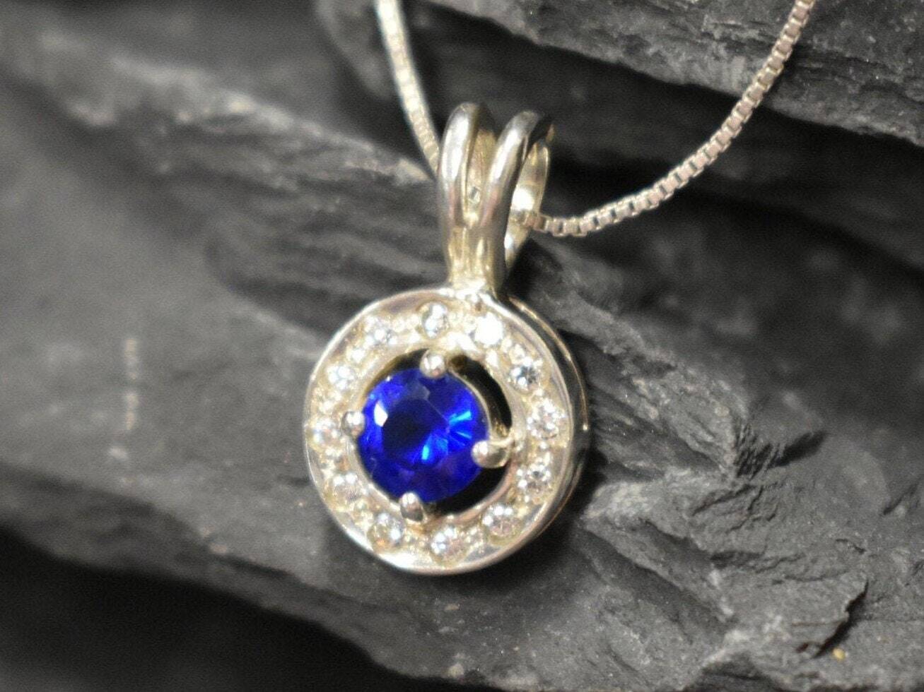 Created Sapphire Pendant made in 925 Sterling Silver with Round Created Blue Sapphire in Halo setting, September Birthstone gift idea, symbolizes sincerity, truth, and faithfulness, ideal for everyday wear and perfect for birthday gifting and special occasions.