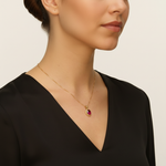 Chic 18k gold vermeil pendant showcasing an oval created ruby, a timeless piece for July birthdays and meaningful gifts.