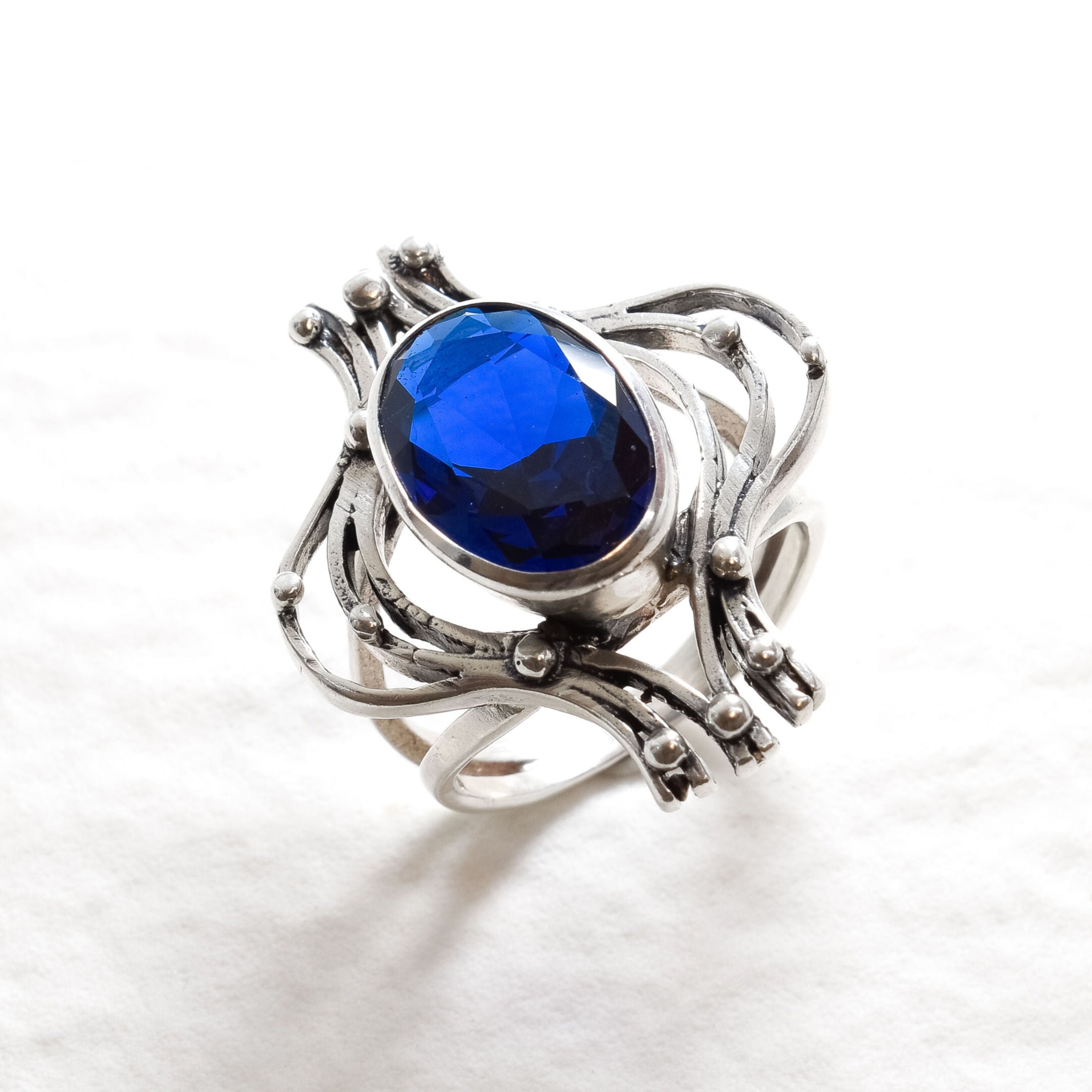 Created Sapphire Ring made in 925 Sterling Silver with Oval Created Blue Sapphire in Bezel setting, September Birthstone gift idea, symbolizes sincerity, truth, and faithfulness, ideal for everyday wear and perfect for birthday gifting and special occasions.