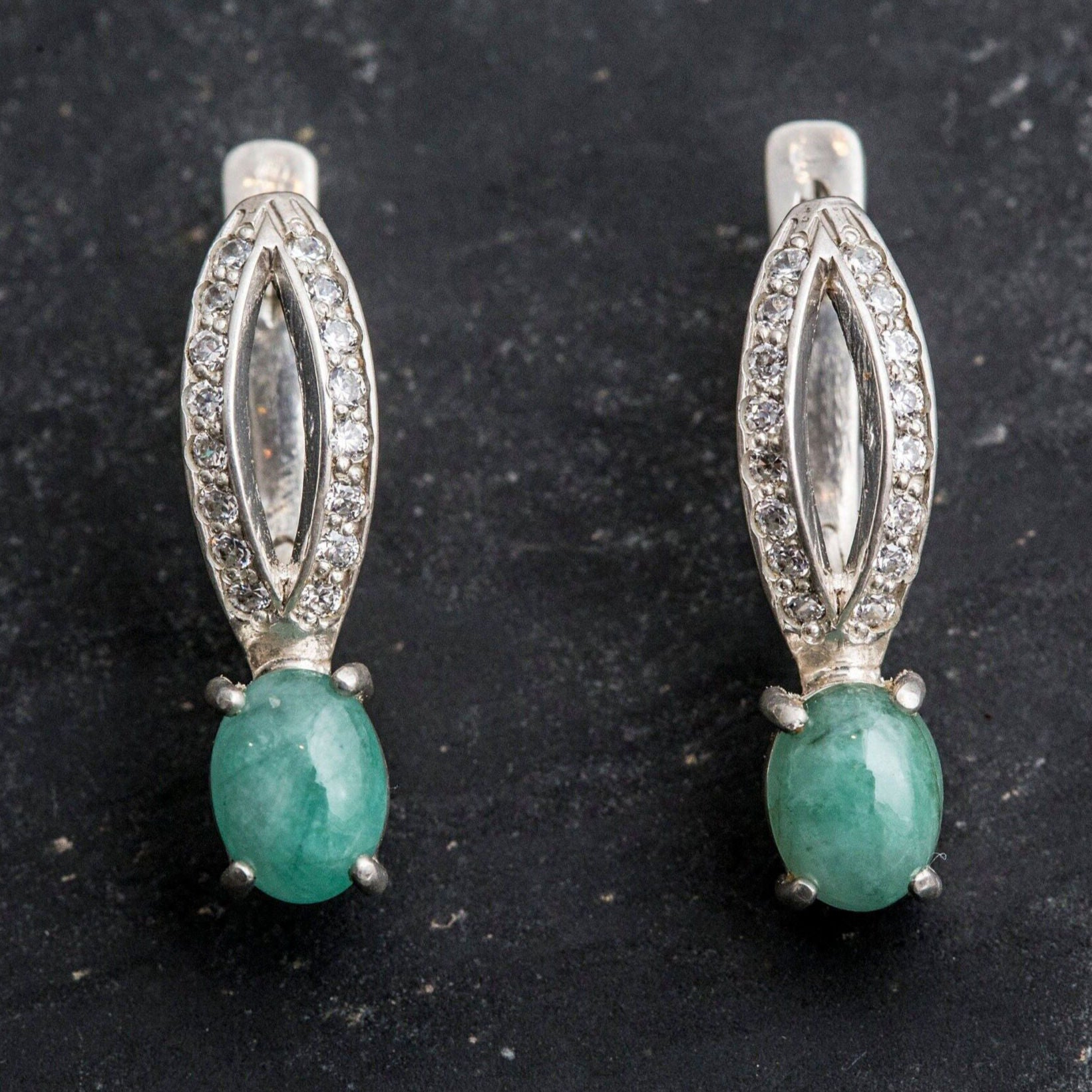 Natural Emerald Earrings made in 925 Sterling Silver with Oval Natural Green Emerald in Solitaire with Accents setting, May Birthstone gift idea, symbolizes growth, harmony, and deep emotional healing, ideal for everyday wear and perfect for birthday gifting and special occasions.