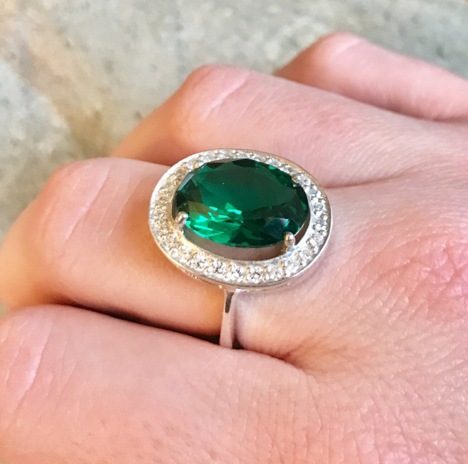 Elegant 925 Sterling Silver ring featuring a stunning oval Created Green Emerald, perfect for birthdays and special occasions.