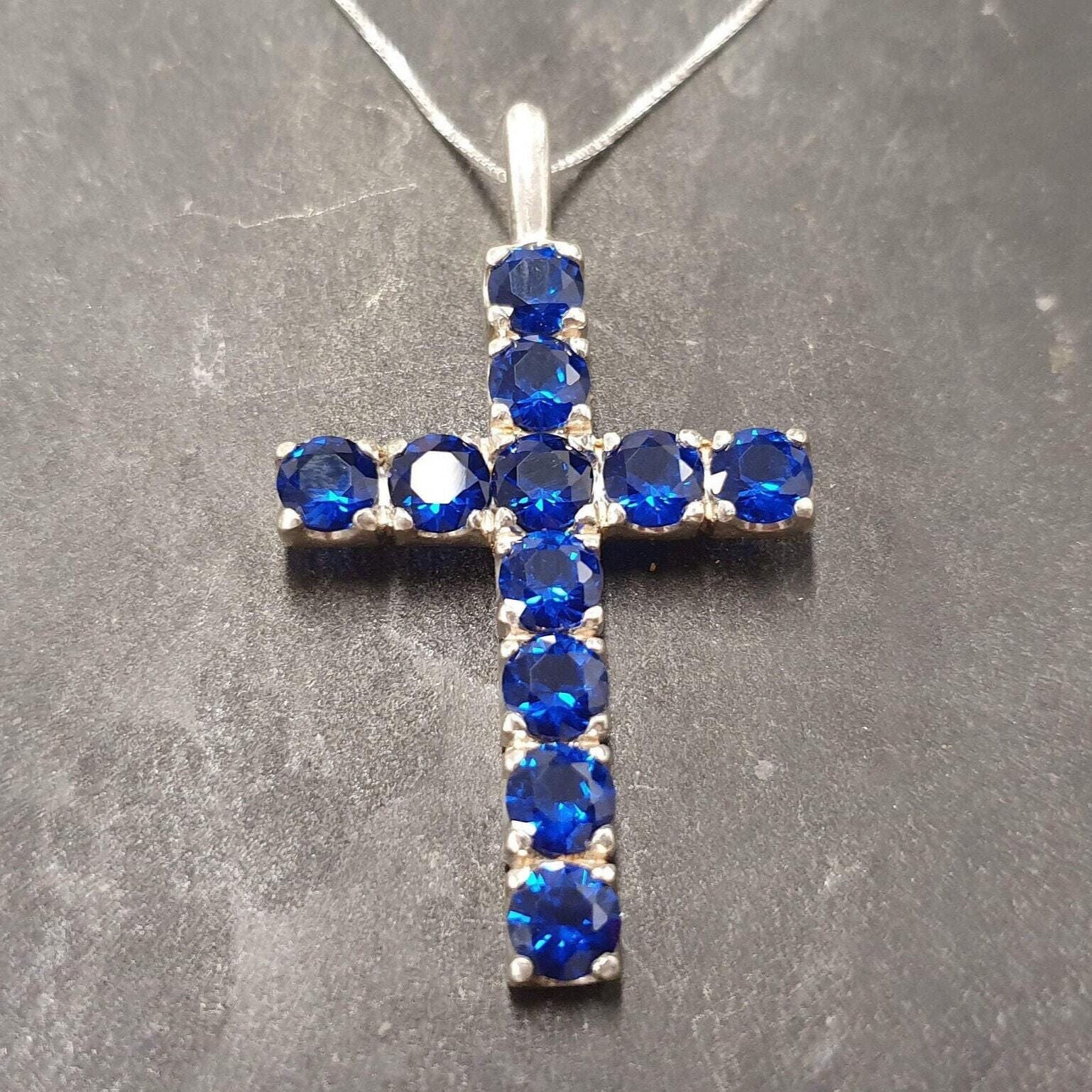 Charming Created Sapphire Pendant in silver, showcasing a round blue sapphire—great for celebrating September birthdays and love.