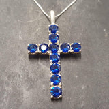Charming Created Sapphire Pendant in silver, showcasing a round blue sapphire—great for celebrating September birthdays and love.