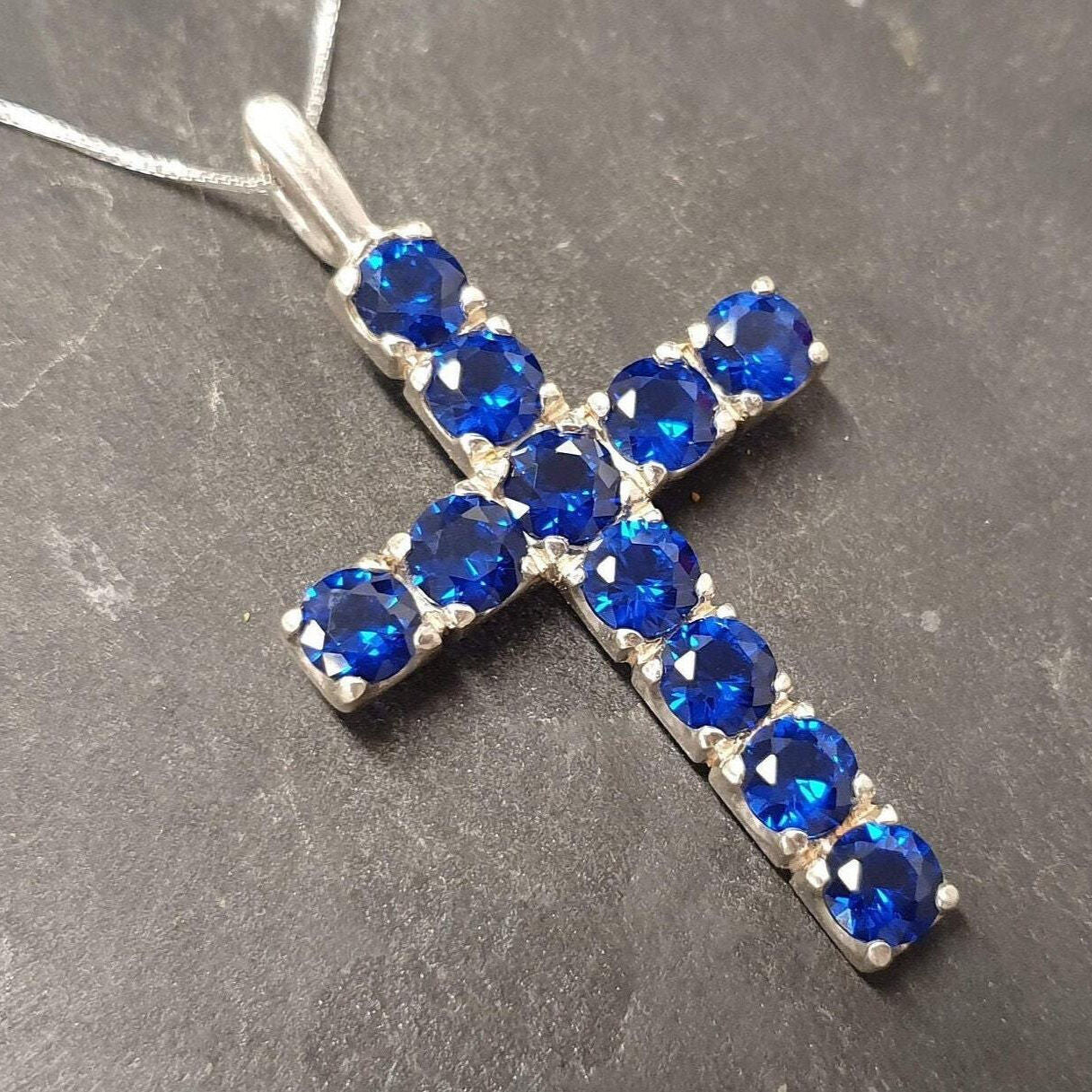Created Sapphire Pendant in sterling silver, showcasing a round blue sapphire, ideal for daily wear and heartfelt gifts.