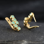 18k Gold Vermeil Earrings with natural green emeralds, perfect for those seeking beauty and emotional healing in their jewelry.
