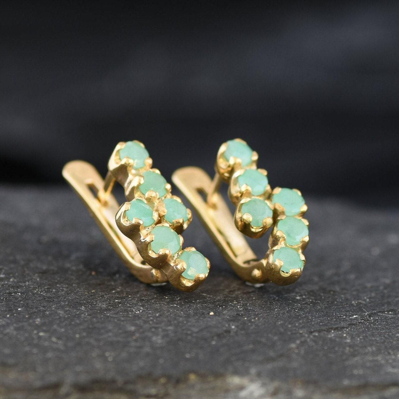 Stunning 18k Gold Vermeil Emerald Earrings showcasing vibrant green emeralds, a beautiful choice for any occasion or everyday wear.