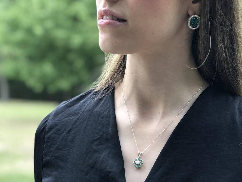 Elegant 925 Sterling Silver Natural Emerald Pendant featuring a vibrant cluster setting, ideal for May birthdays and special occasions.