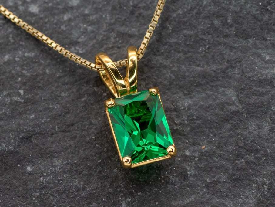 Emerald pendant in 18k gold vermeil, prong set with created emerald, a May birthstone, perfect for everyday and special occasions.