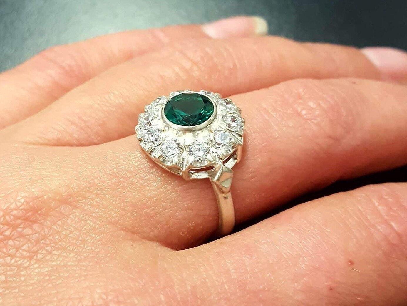 Stylish 925 Sterling Silver ring featuring a Round Created Green Emerald, perfect for May birthdays and special occasions.