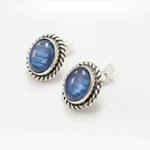 Artisan-made silver earrings with deep blue kyanite cabochons, classic vintage jewelry design.