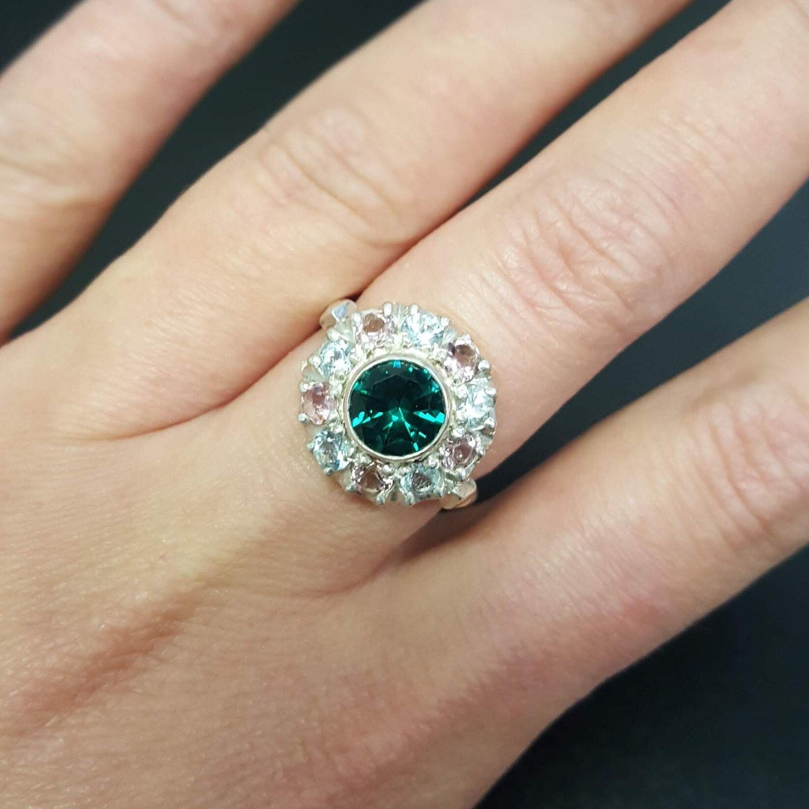 Created Emerald Ring in 925 Sterling Silver, featuring a round green emerald in a halo setting, perfect for daily wear and gifting.