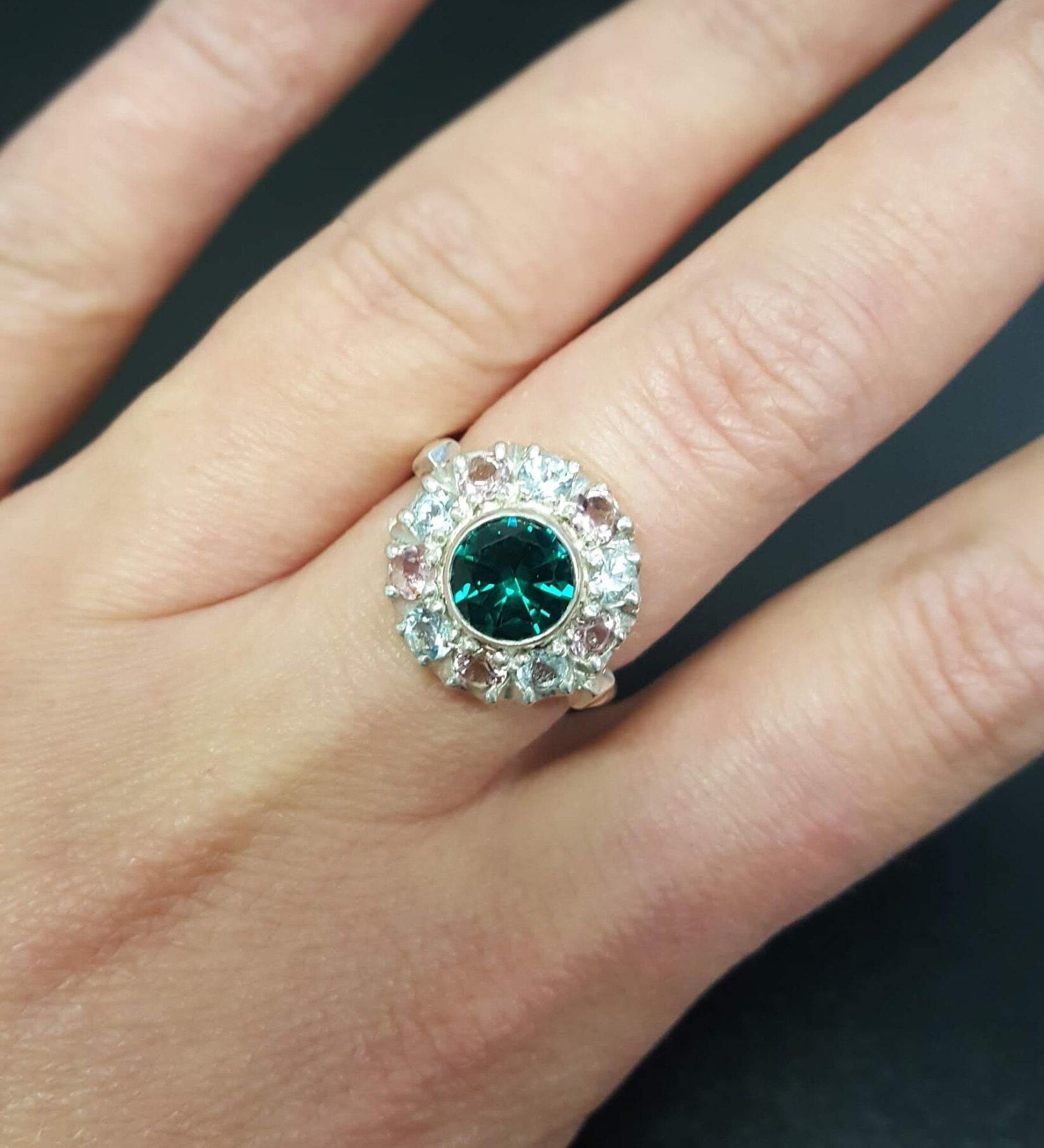 Created Emerald Ring in 925 Sterling Silver, featuring a round green emerald in a halo setting, perfect for daily wear and gifting.