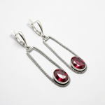 Stylish ruby earrings in 925 sterling silver, featuring a chic bezel setting, symbolizing passion and perfect for any occasion.